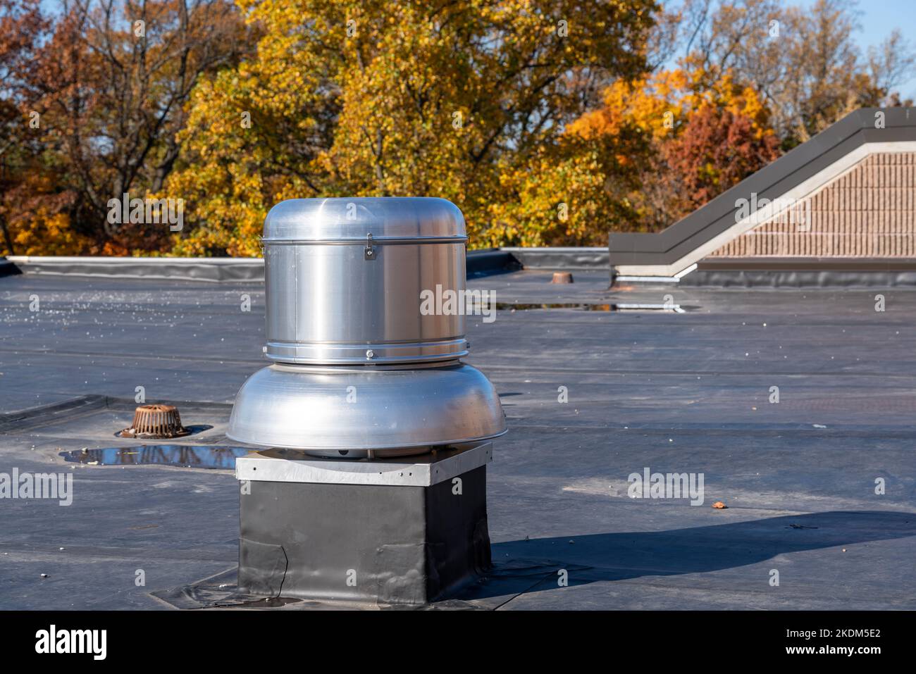 Photo of a roof exhaust ventilation fan on a new EPDM on a large