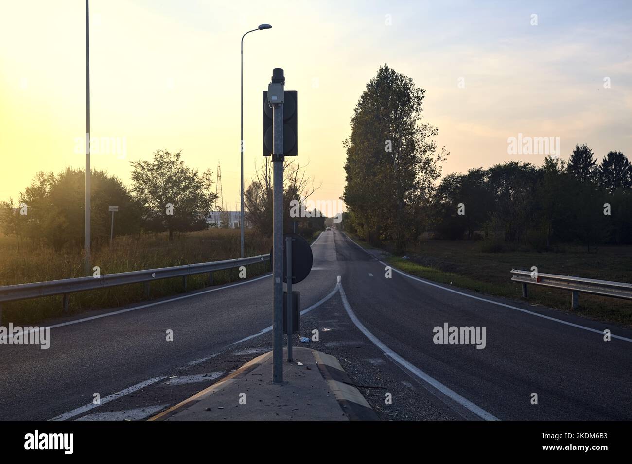 Fork between two lanes in a roundabout in the italian countryside at sunset Stock Photo Alamy