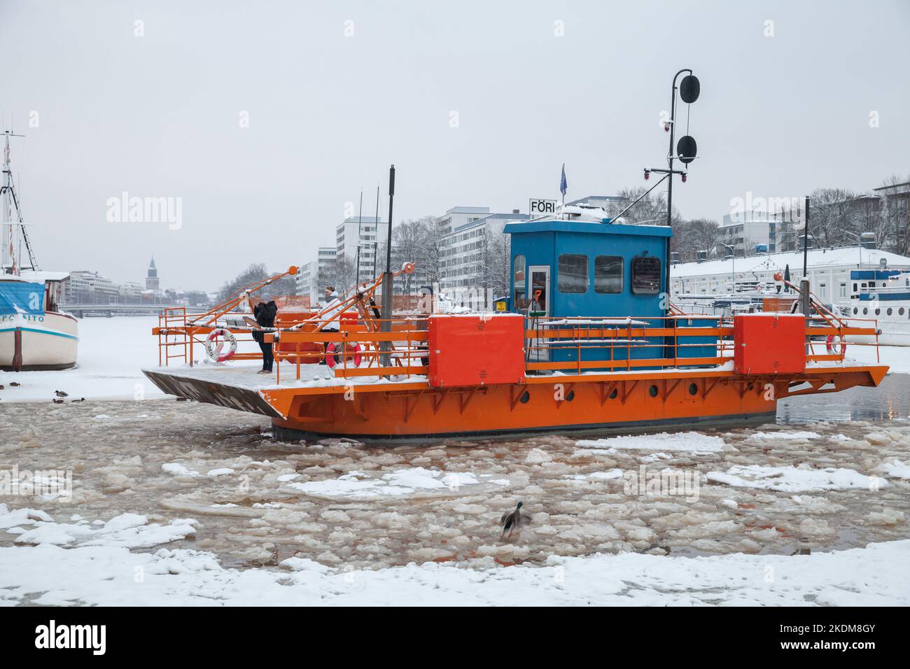 Turku, Finland - January 17, 2016: Passengers are on Fori city boat, this is a light traffic ferry that has served the Aura River for over a hundred y Stock Photo
