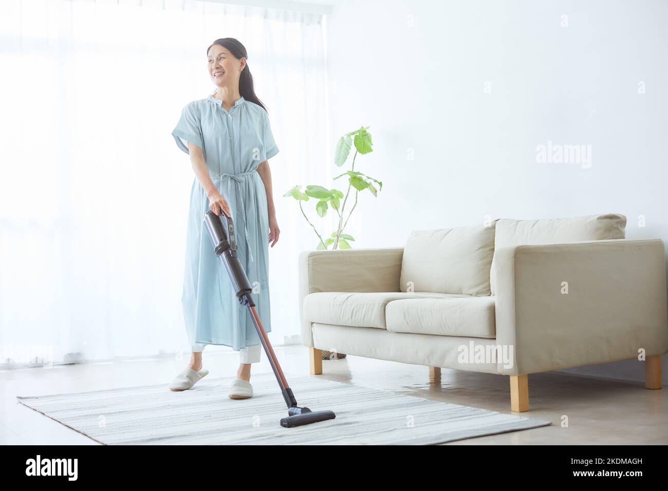 Japanese senior woman cleaning at home Stock Photo Alamy