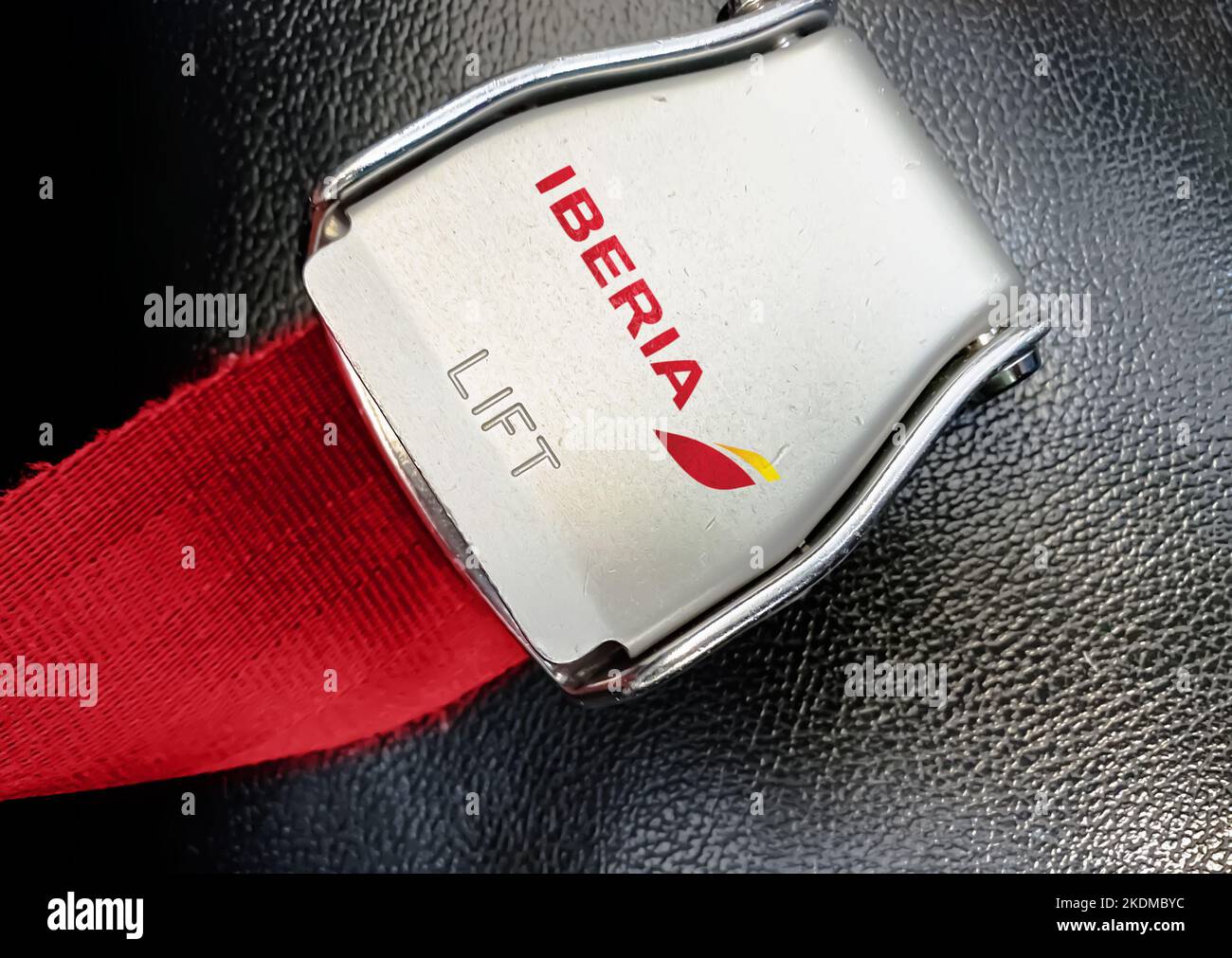 Madrid, SP, July 2022: detail of the buckle of the seat belt with the logo of Iberia on an empty seat. Iberia is the flag carrier of Spain. Iberia is Stock Photo
