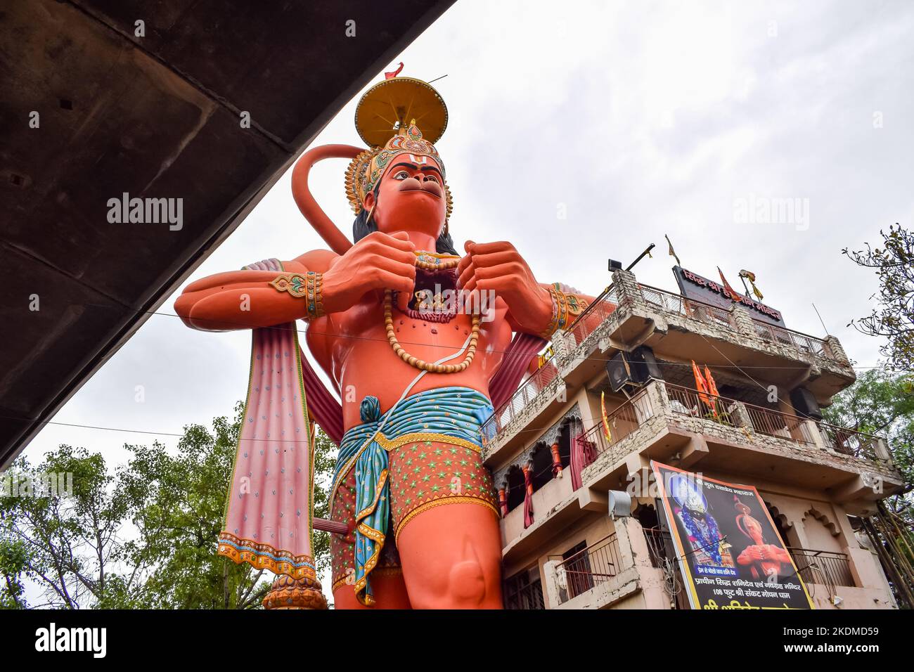 Big statue of Lord Hanuman near the delhi metro bridge situated near