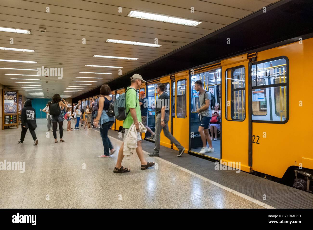 Budapest, Hungary - 3 September 2022: Passengers boarding the yellow train wagons of Budapest subway Stock Photo