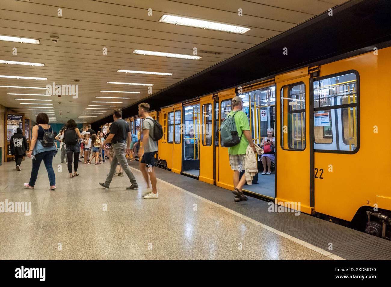 Budapest, Hungary - 3 September 2022: Passengers boarding the yellow train wagons of Budapest subway Stock Photo