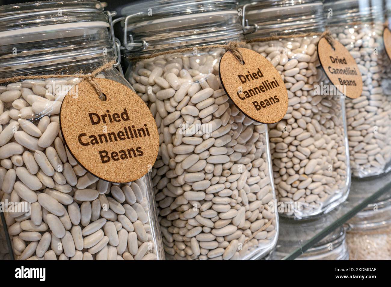 CANNELLINI BEANS DISPLAY type of white kidney bean in glass jars popular in Italy used in minestrone and other Mediterranean dishes. Stock Photo