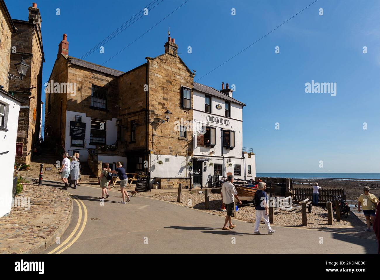Robin Hood's Bay, UK: The Bay Hotel on King Street, overlooking the dock entrance from the North Sea Stock Photo