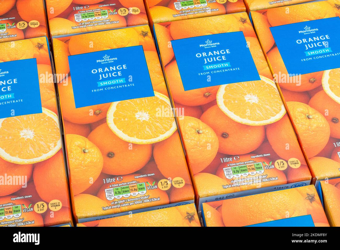 Morrison's orange juice cartons & labelling: showing sugar / carbohydrate content. For own label food packaging, food labels. Vitamin C intake, 1 of 5 Stock Photo