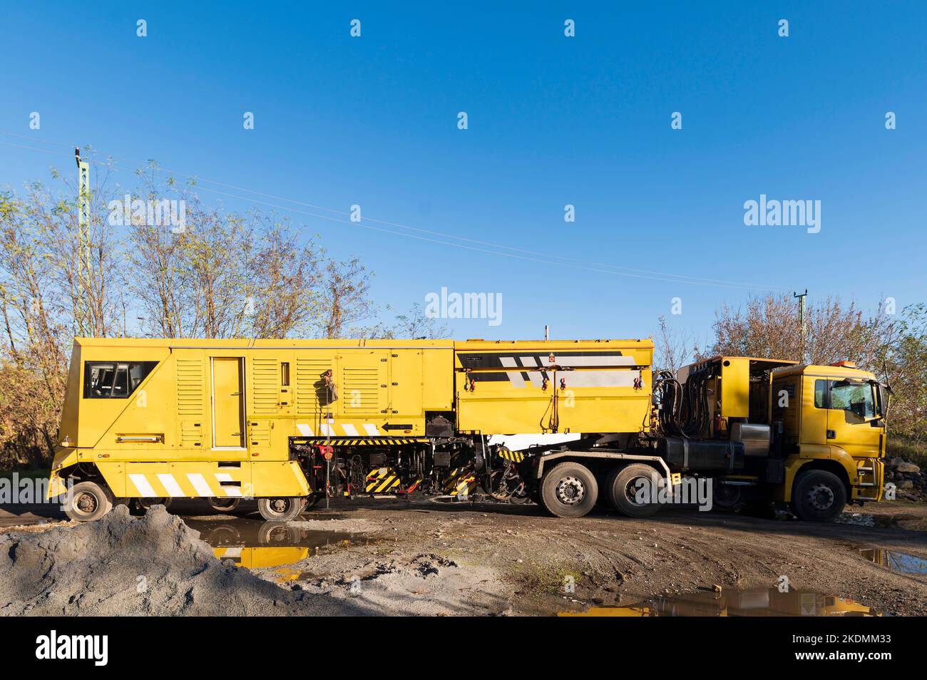 A milling train as a road-rail vehicle , can drive on the road and then work on the track and grind and mill rails Stock Photo