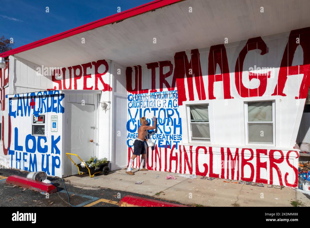 Branch Township, Michigan Stephen Lee paints Trump slogans on a