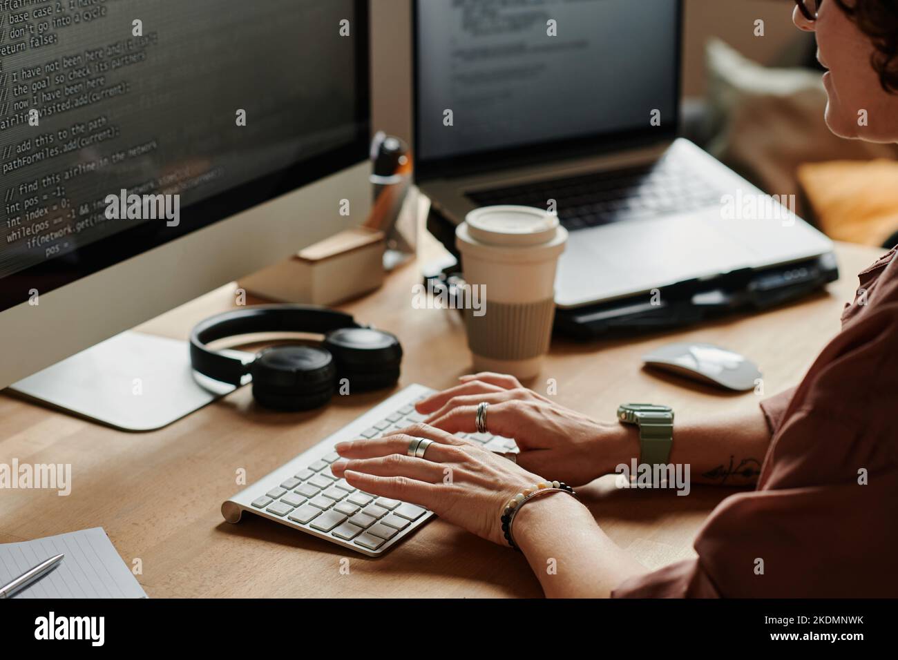 hands of young programmer touching keys of desktop computer keypad ...