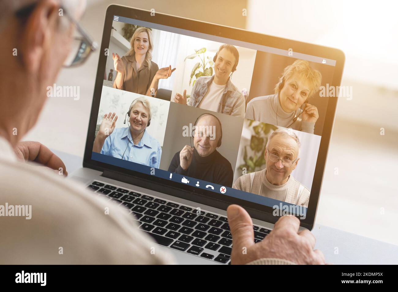Man Working From Home Having Online Group Videoconference On Laptop. Stock Photo