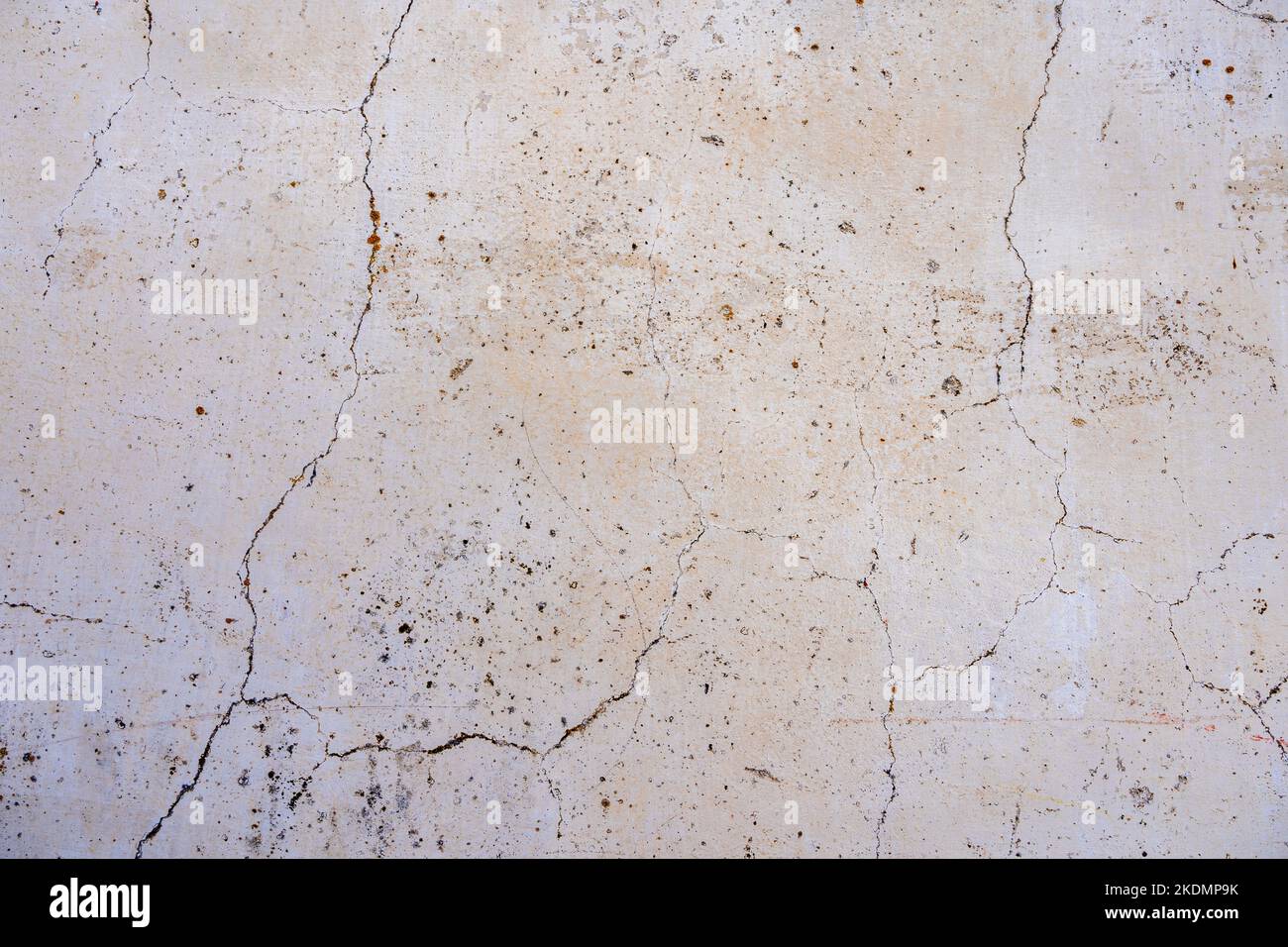 Beige concrete background, cracked wall texture Stock Photo