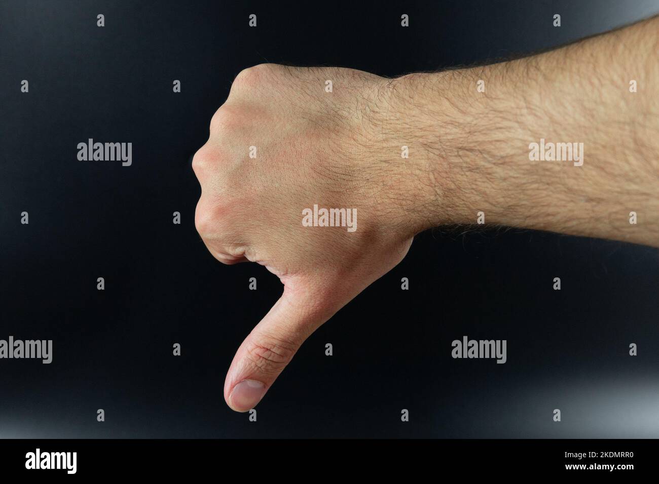 Thumbs down sign isolated on background. Unlike, bad, unapproved or failed gesture. Stock Photo