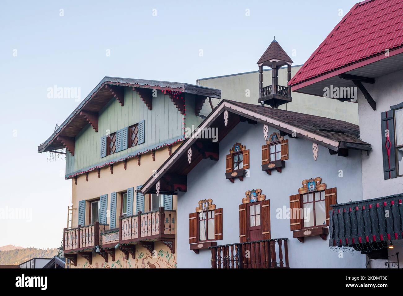 Bavarian style buildings painted pastel blue and green in the German-themed town of Leavenworth, Washington, USA. Stock Photo
