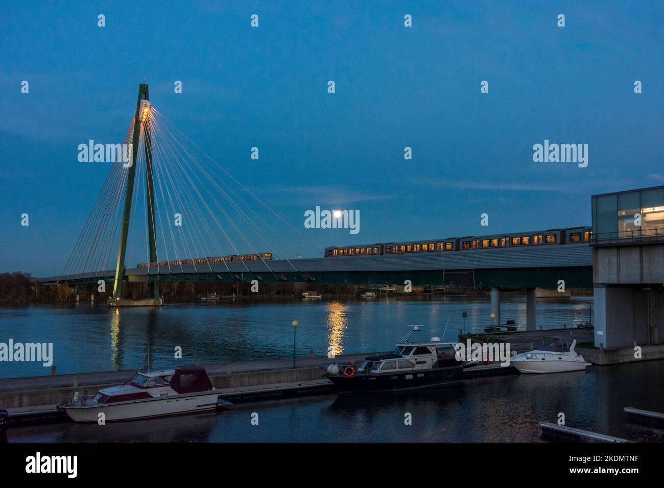 Wien, Vienna full moon above river Donau (Danube), subway U2 bridge