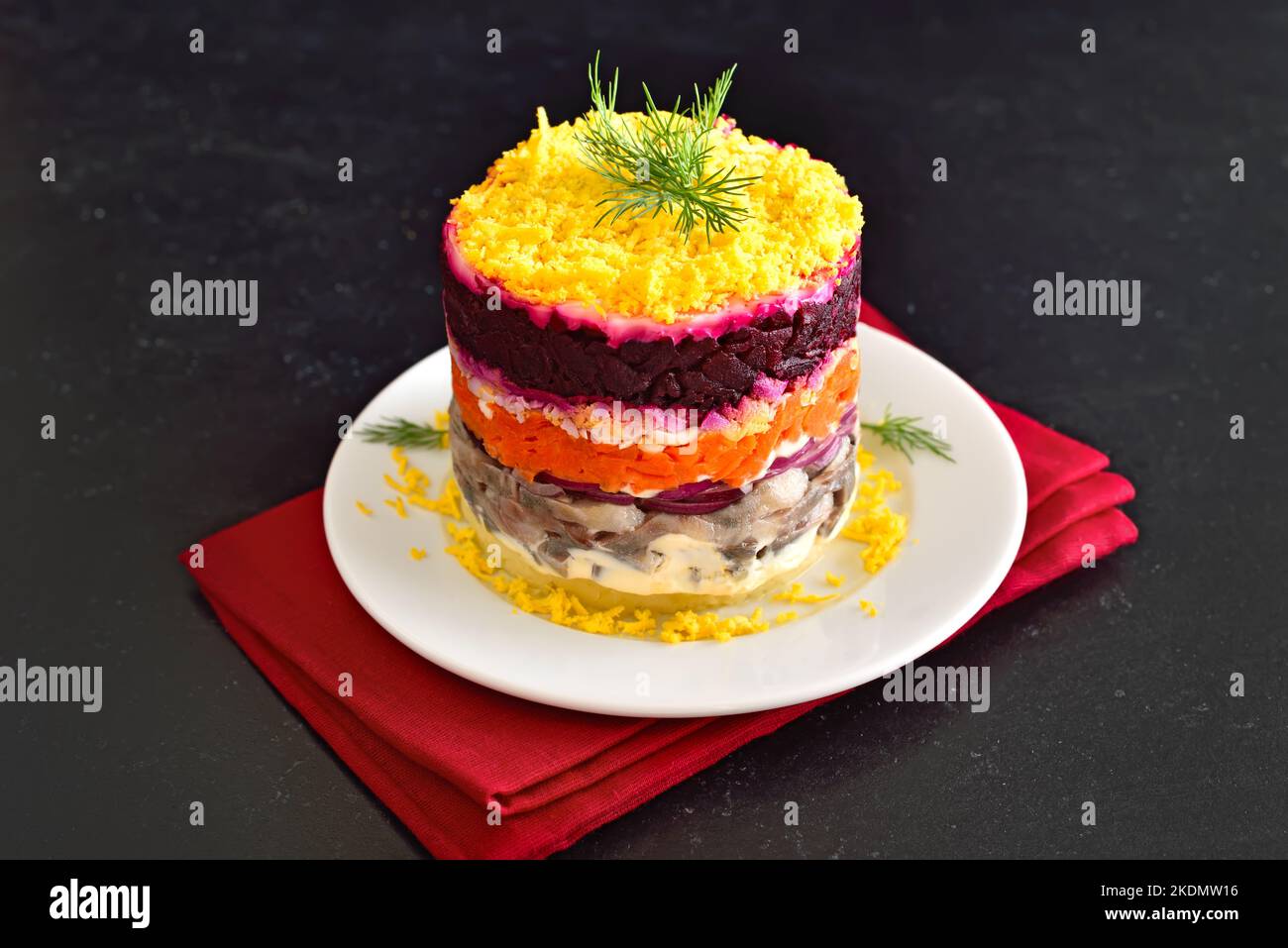 Layered salad with beet, herring, carrots and potatoes, close up view Stock Photo