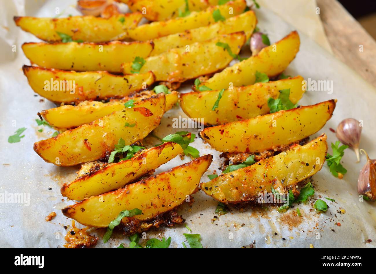 Roasted potato wedges with parsley Stock Photo