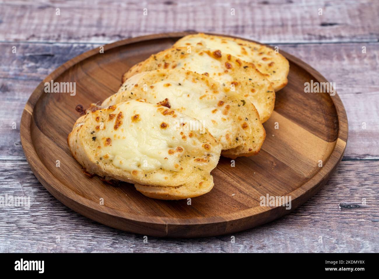 Hot slices of garlic bread with cheese Stock Photo