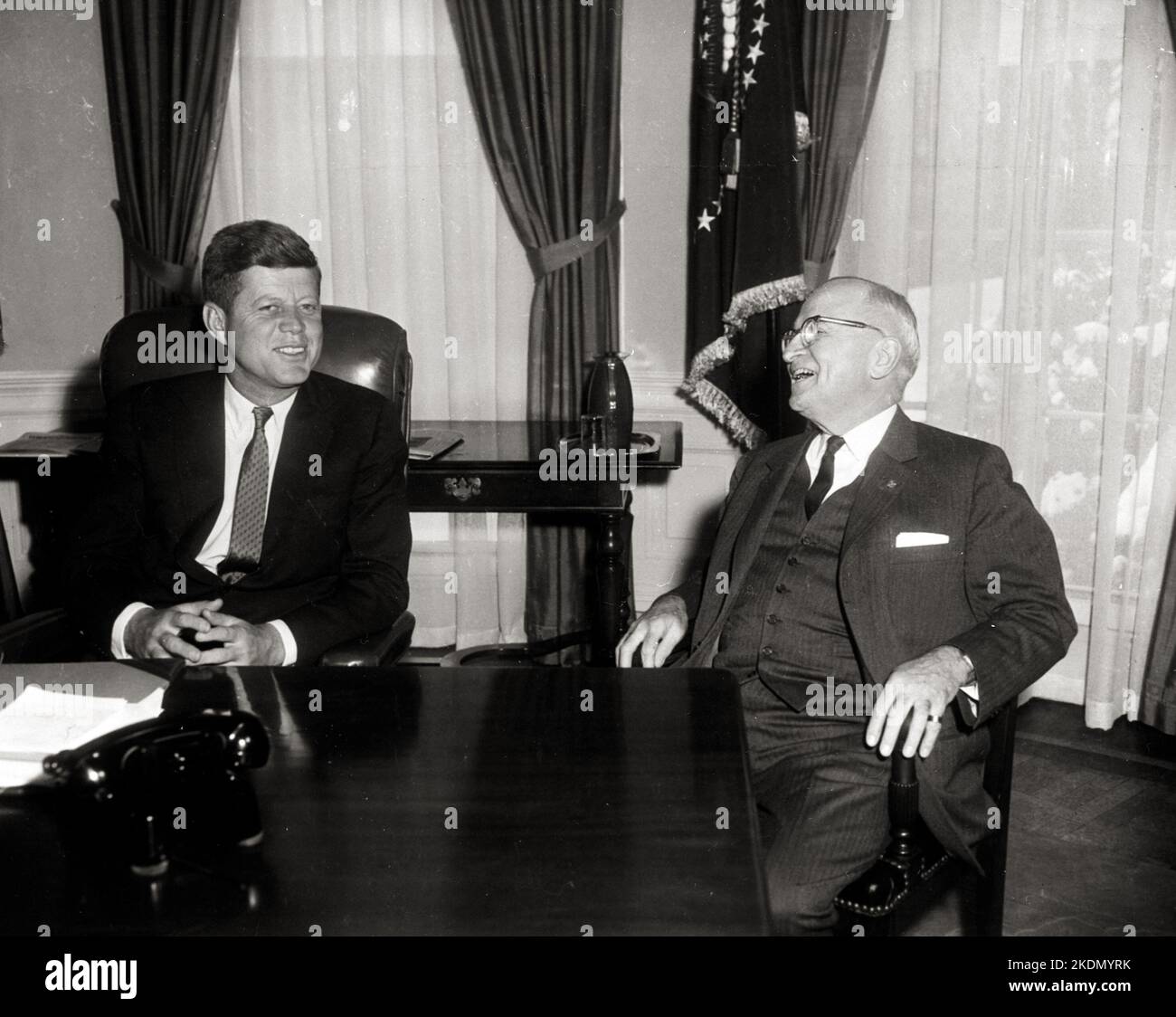 President John F. Kennedy conferring with former President Harry S. Truman in the Oval Office, on Kennedy's first full day in the White House. 21 Jan 1961 Stock Photo