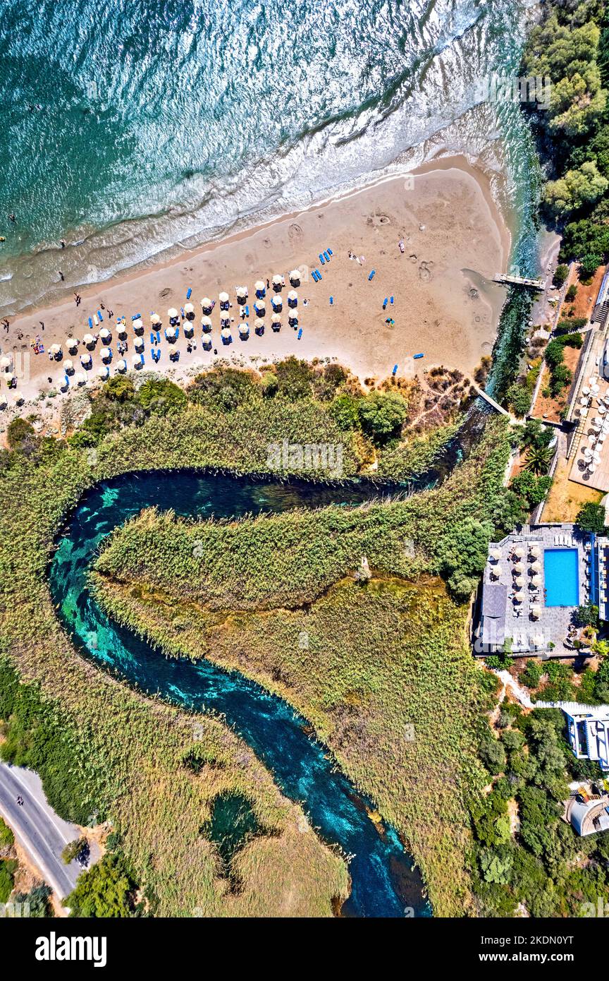 Aerial view (drone) of Almyros beach (and wetland) close to Agios Nikolaos town, Lasithi prefecture, Crete, Greece. Stock Photo