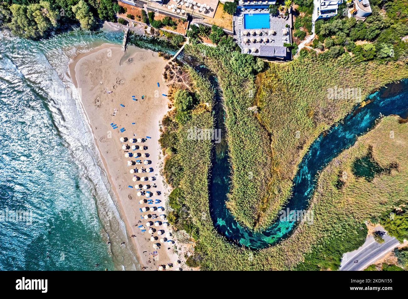 Aerial view (drone) of Almyros beach (and wetland) close to Agios Nikolaos town, Lasithi prefecture, Crete, Greece. Stock Photo