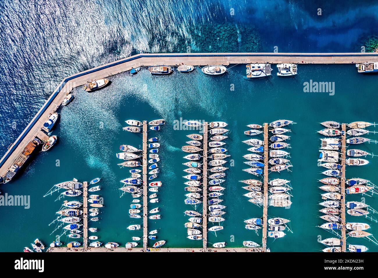 Top down view of the marina of Agios Nikolaos town, Lassithi, Crete island, Greece. Stock Photo