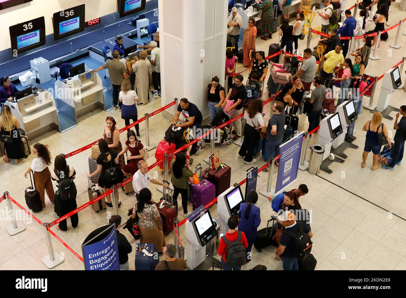 Santos Dumont Airport passengers in line at the boarding counters. Travellers at airport lobby, baggage drop area Stock Photo