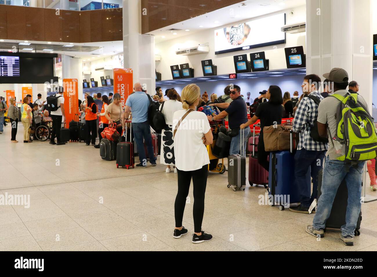 Santos Dumont Airport passengers in line at the boarding counters. Travellers at airport lobby, baggage drop area Stock Photo