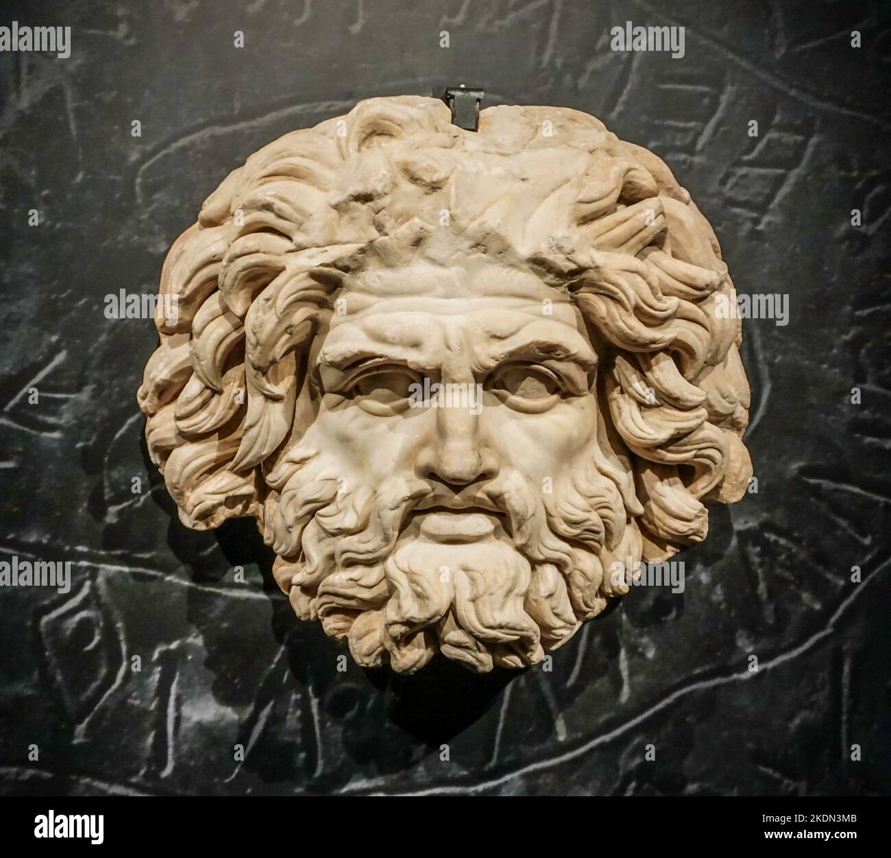 A Roman marble sculpture of the Mask of Jupiter,  on display in the Museum of Roman History, Nimes France. Stock Photo