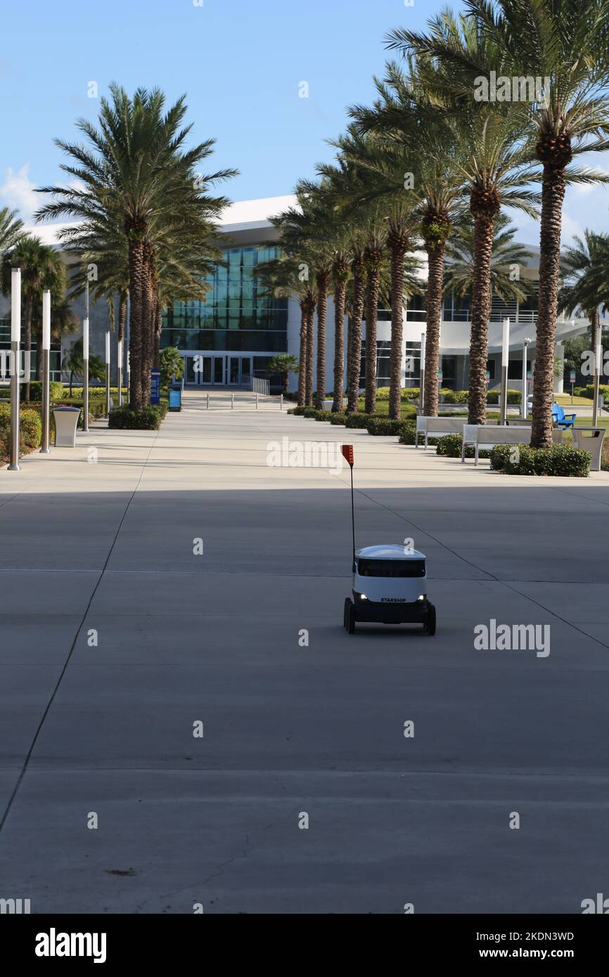 Autonomous Starship Delivery robot delivers food to students at Embry-Riddle Aeronautical University. Stock Photo