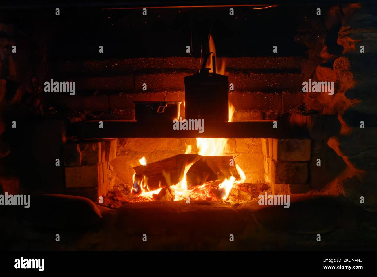Cooking over the open fire at the Gouland Downs DoC hut, Heaphy track, Kahurangi National Park