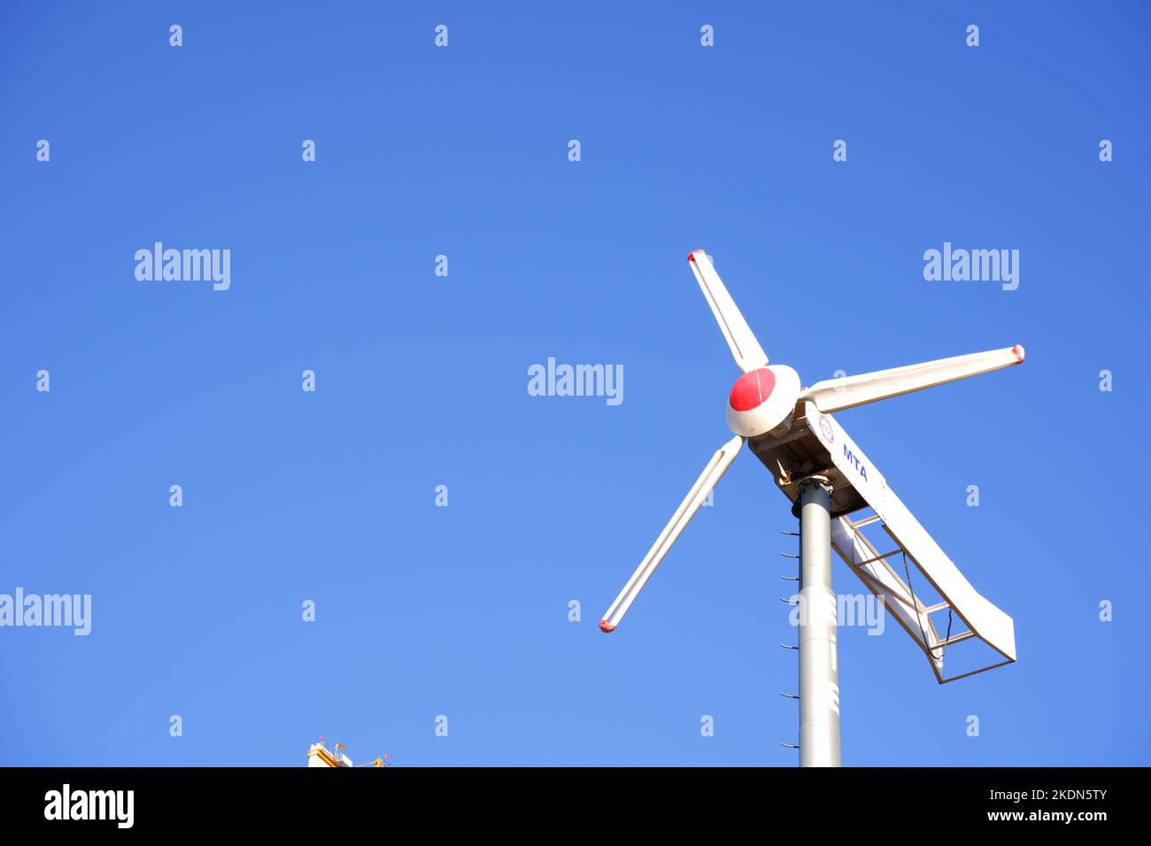 Wind turbine to produce electricity with clear sky at the background Stock Photo