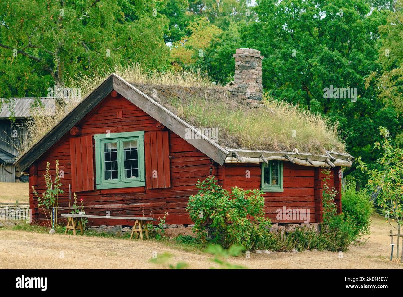 Old scandinavian farm house with green roof in town of Halmstad, Sweden selective focus Stock