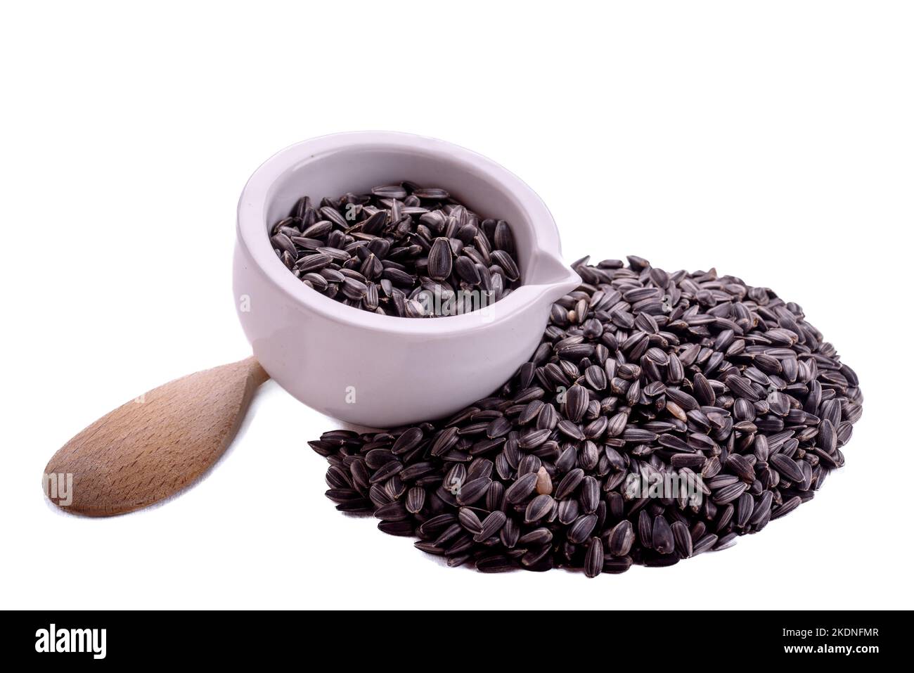 dried grains bird food. Black sunflower seeds in pot.. Black sunflower