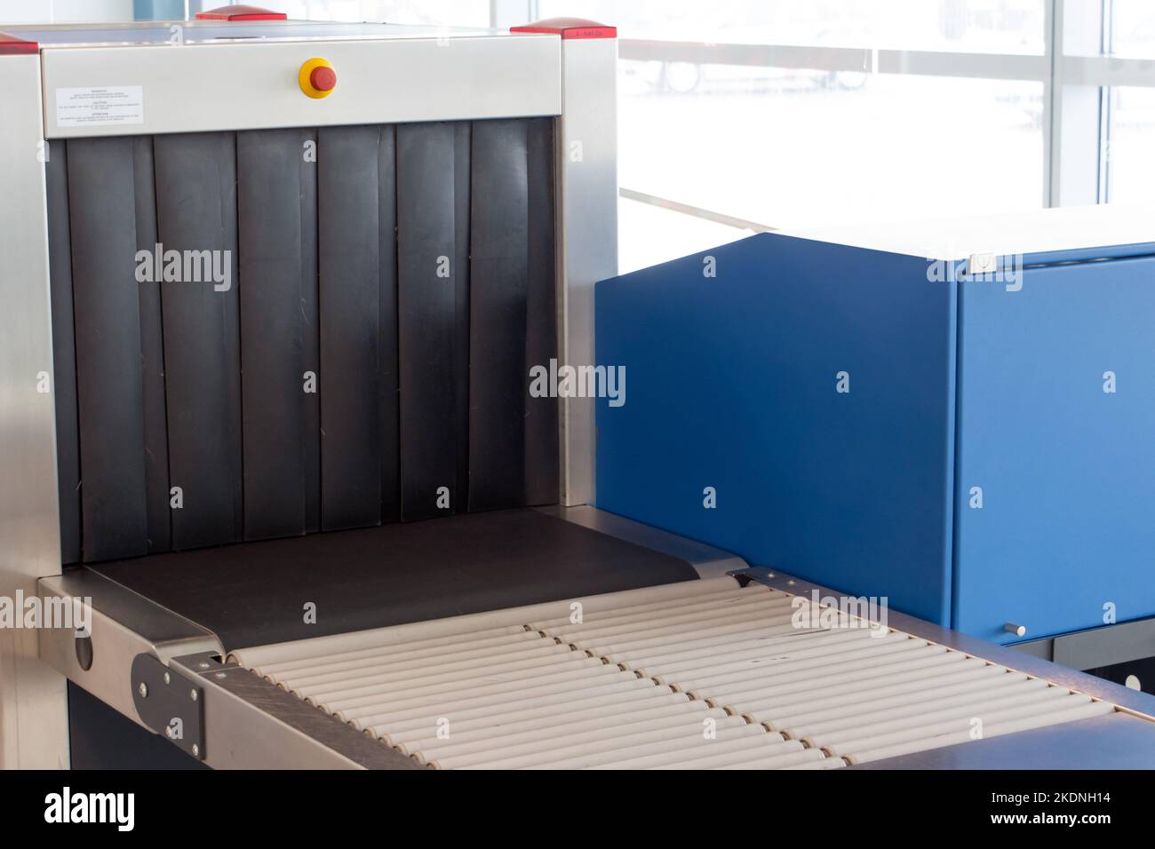 The luggage scanner at airport terminal. A baggage checkpoint at departure gate. Stock Photo