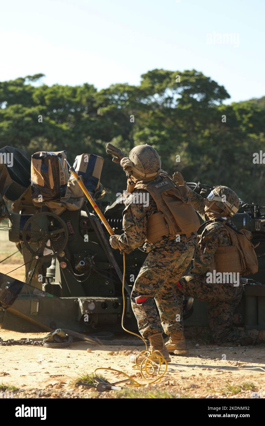 U.S. Marines with 3rd Battalion, 12th Marines prepare an M777 Howitzer for an external lift at Camp Hansen, Okinawa, Japan, Nov. 3, 2022. The training increased battlefield proficiency and combat readiness across Marine Air-Ground Task Force units while expanding the ability for commanders to relocate artillery assets in austere terrain. (U.S. Marine Corps photo by Lance Cpl. Eduardo Delatorre) Stock Photo