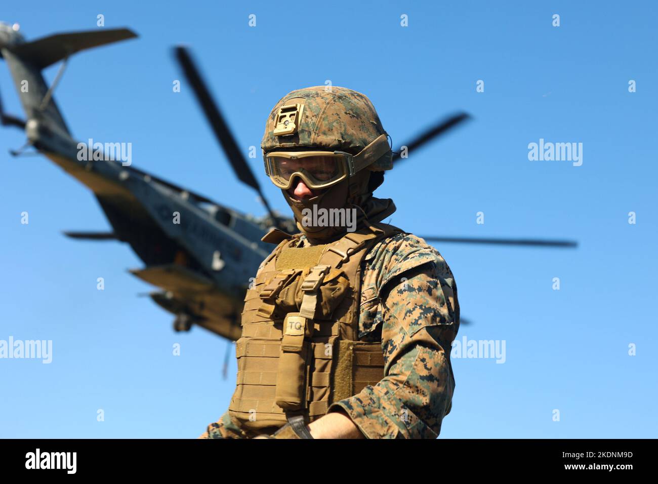 A U.S. Marine with 3rd Battalion, 12th Marines prepares for the arrival of a CH-53E Super Stallion during a training event at Camp Hansen, Okinawa, Japan, Nov. 3, 2022. The training increased battlefield proficiency and combat readiness across Marine Air-Ground Task Force units by expanding the ability for commanders to relocate artillery assets in austere terrain. (U.S. Marine Corps photo by Lance Cpl. Eduardo Delatorre) Stock Photo