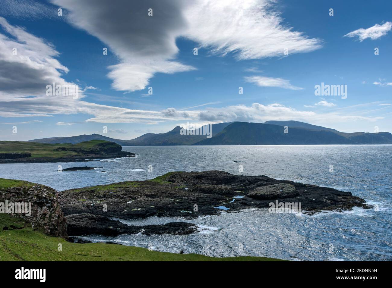 The Isle of Rum from the southern coast of the Isle of Sanday, Scotland, UK Stock Photo