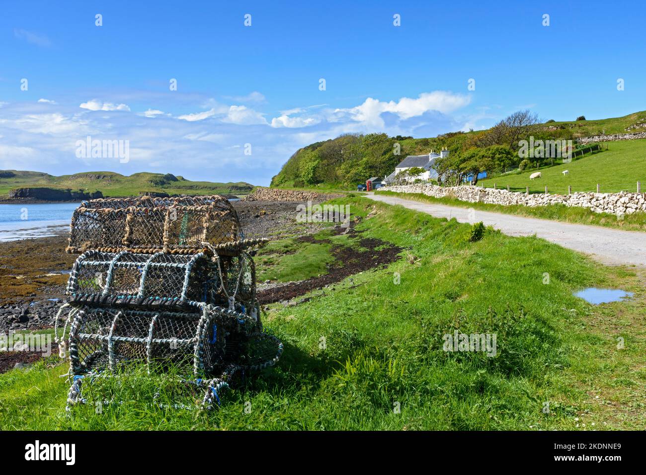 Lobster pots by the road near the village of A' Chill on the Isle of Canna, Scotland, UK Stock Photo