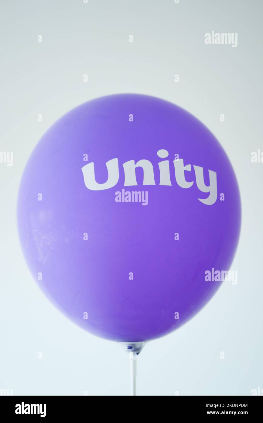 unity text on a purple color ballon Stock Photo - Alamy