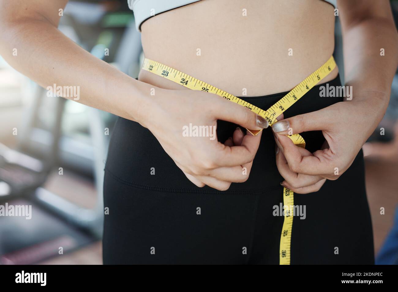 Woman Looking Down Measuring Waist With Measuring Tape Closeup High-Res  Stock Photo - Getty Images