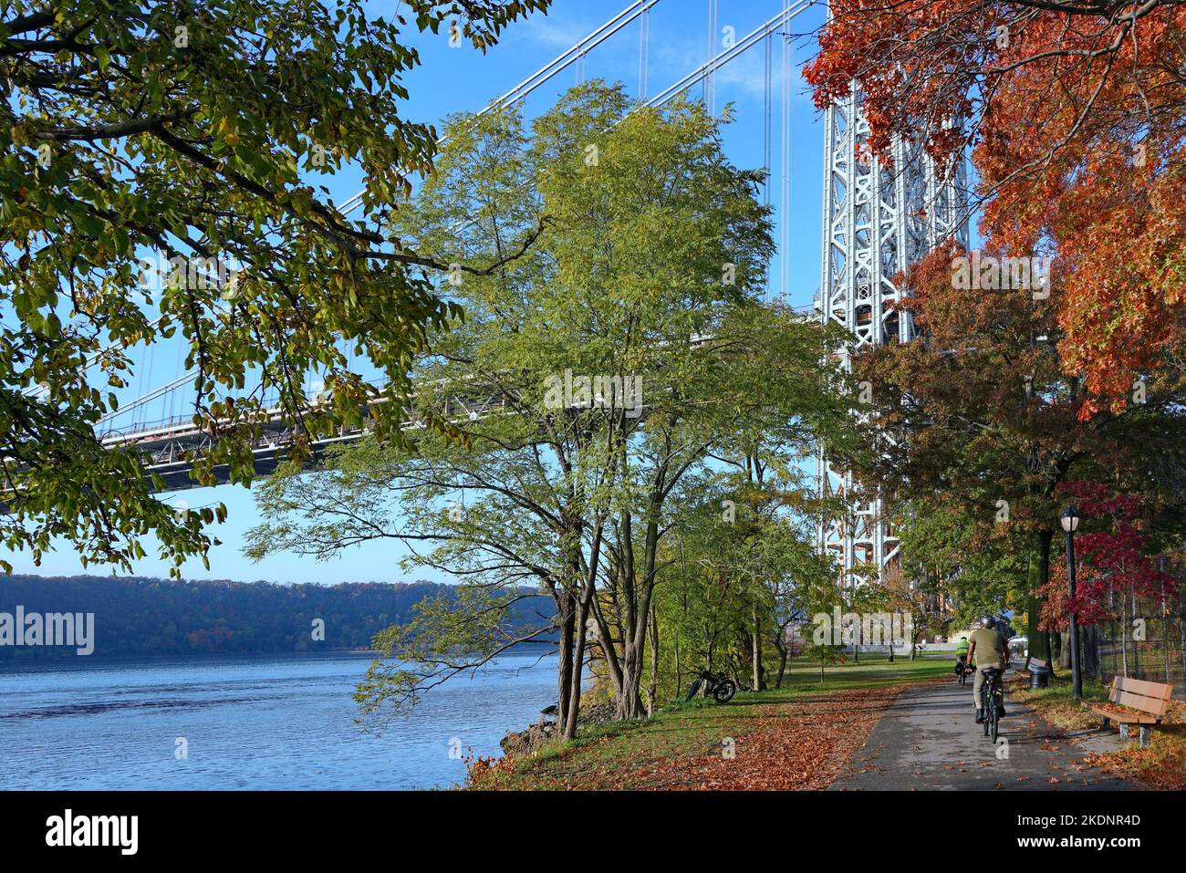 New York City bicycle trail along the Hudson River, passing under the George Washington Bridge Stock Photo