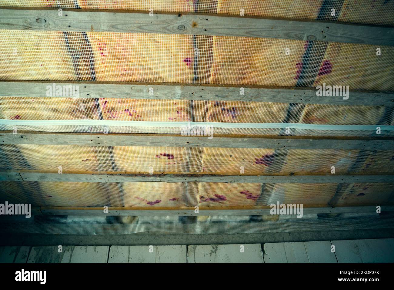 Insulated wooden floor between floors in a private house. Protection of sound and heat