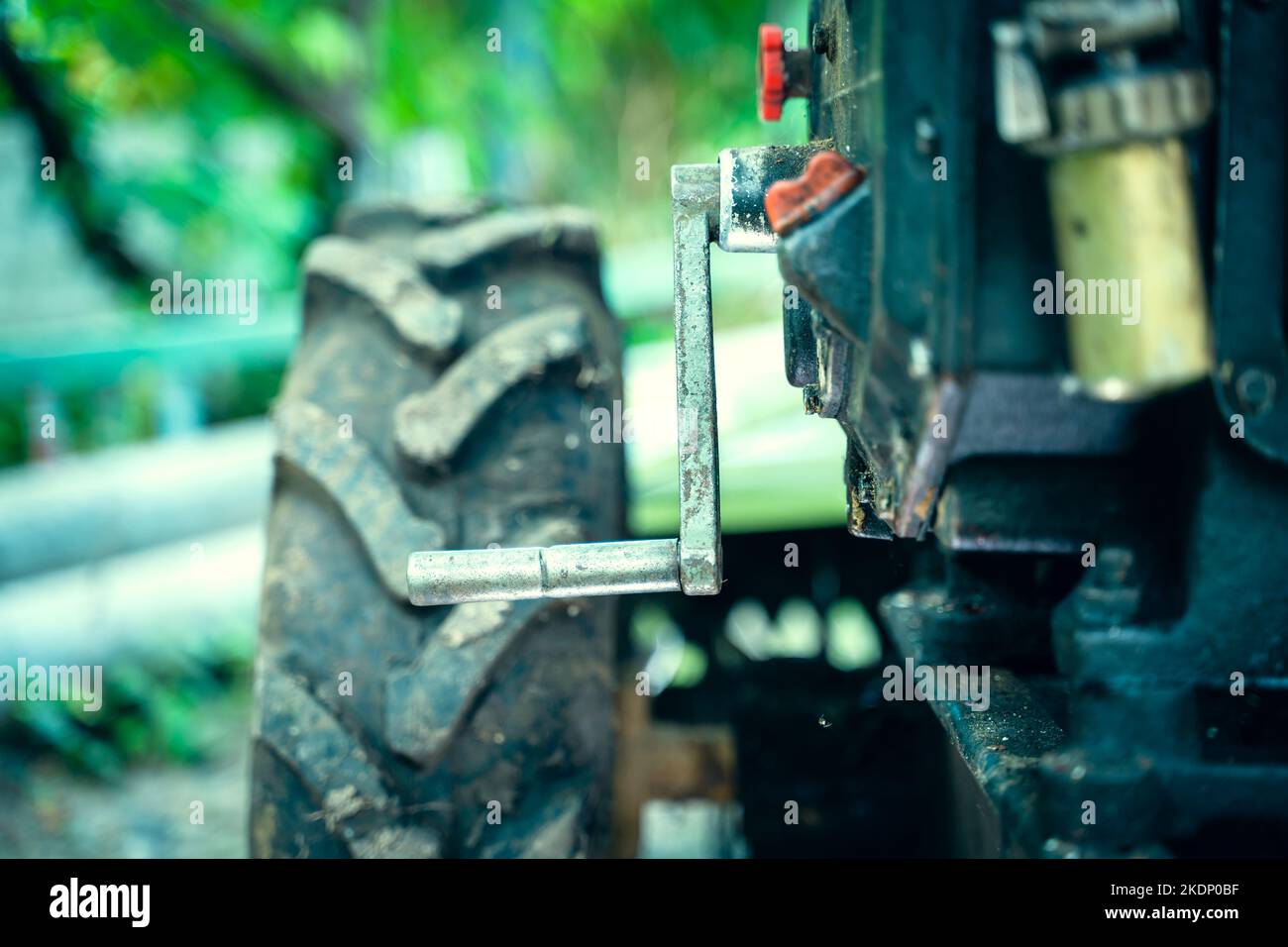 Crooked starter for starting the engine of a walkbehind tractor closeup. Mechanism for manual