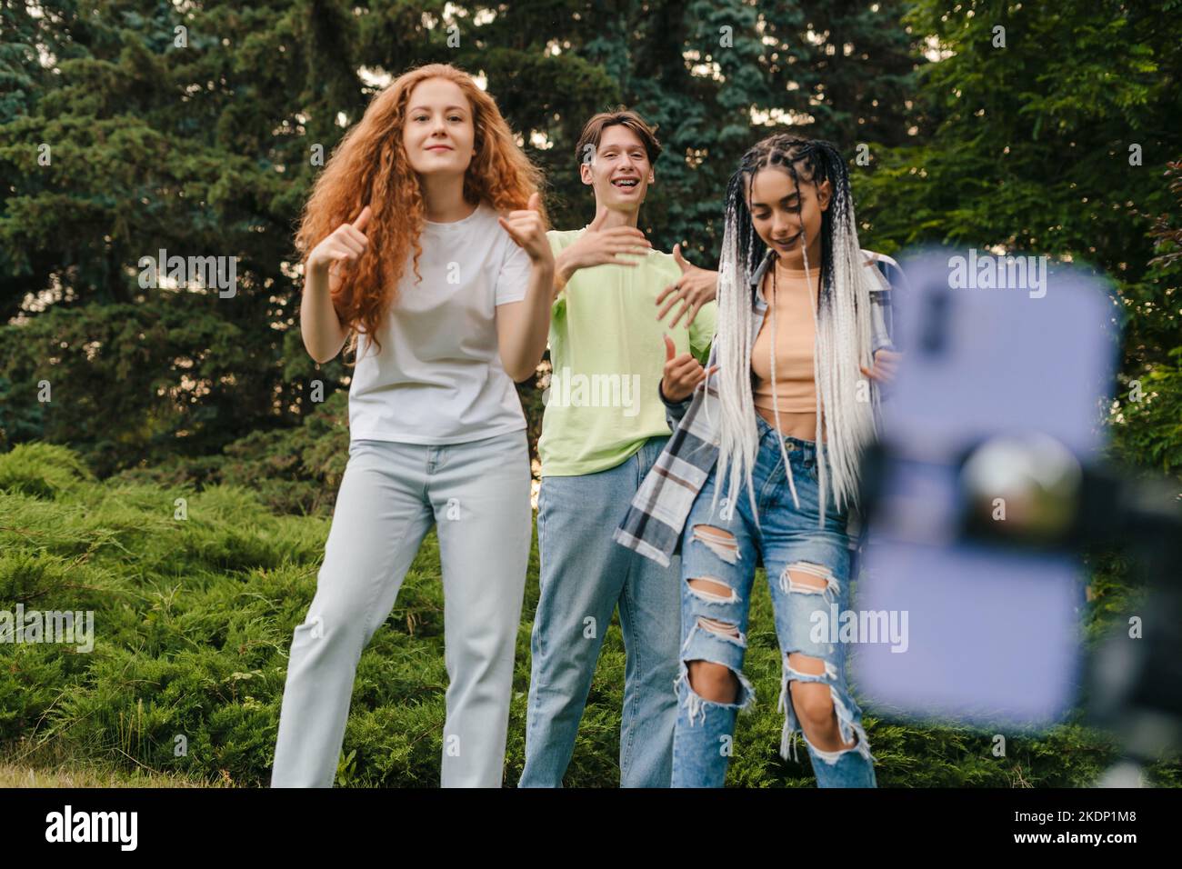 Group of friends recording dancing, making music content for channel. Streaming video.