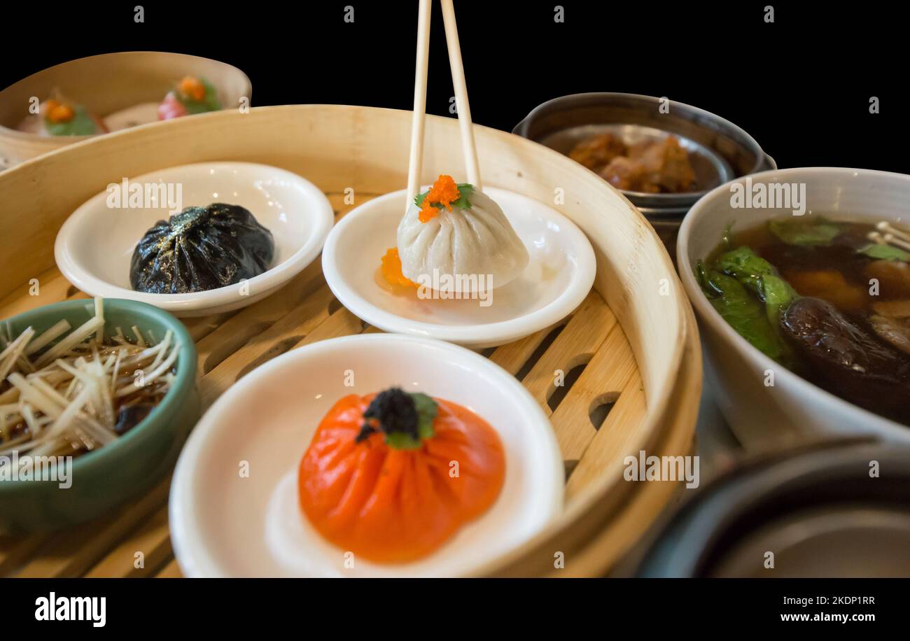 Dim Sum Cut Die cut of white Xiao long bao and set dim sum on black isolated Stock ...
