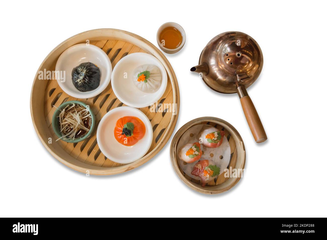 Die cut of Xiao long bao, set dim sum with a set brass teapot on on white isolated. Stock Photo