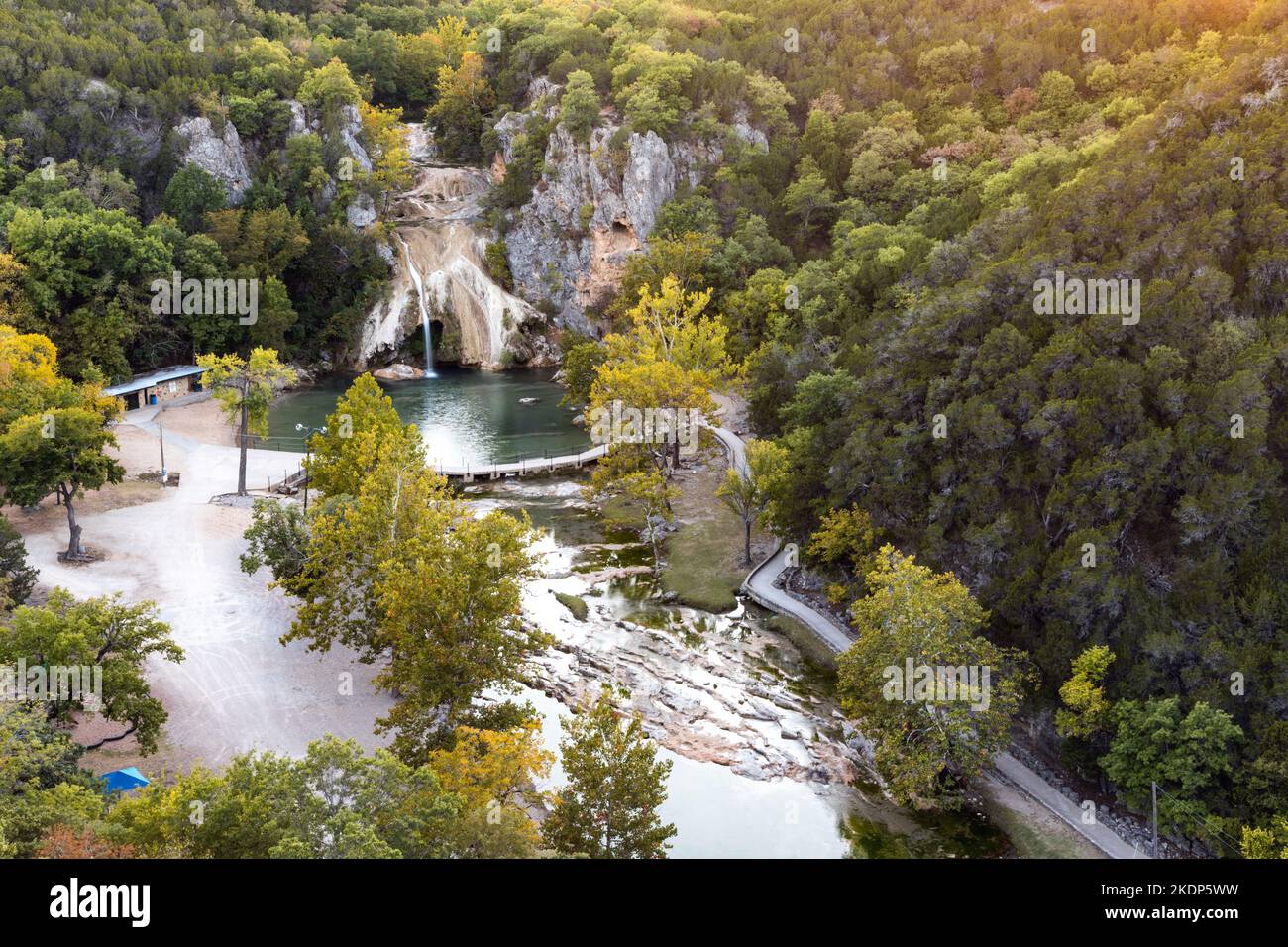 Aerial view of forest on hills and natural pool at Turner Falls in