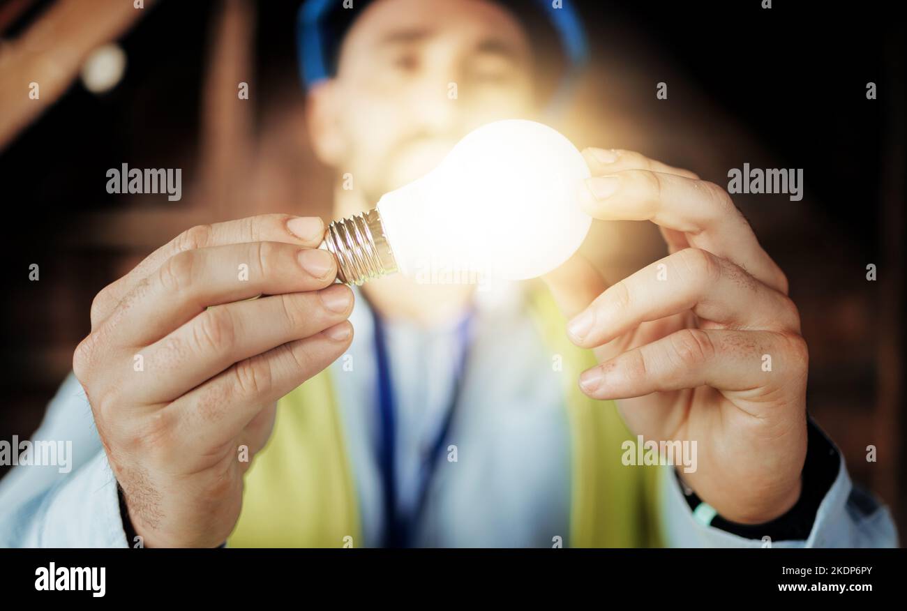 Idea, light and man engineer holding a lightbulb for vision, innovation