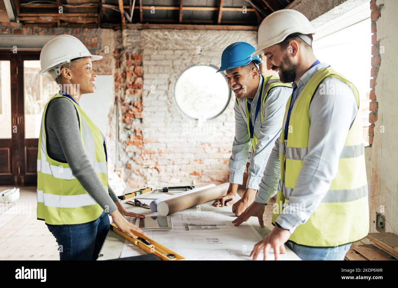 Construction team planning a building blueprint project on site with